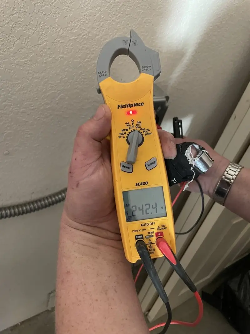 Voltage testing with clamp meter during Ceiling Fan Installation in North Riverside